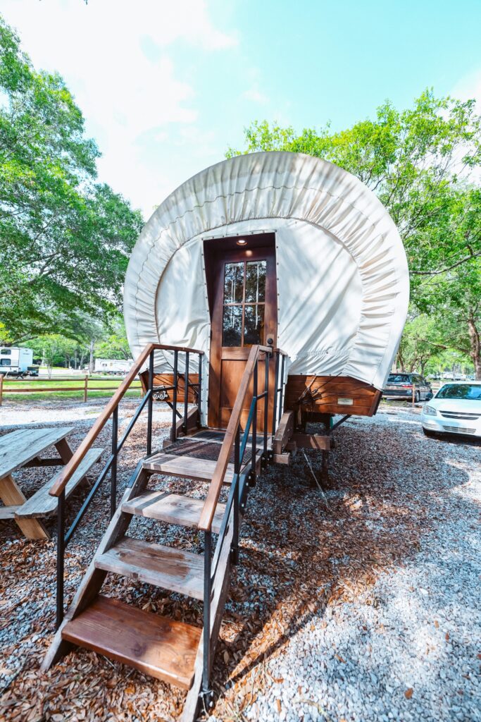 Conestoga style covered wagon glamping unit at Splash RV Resort in Milton Florida