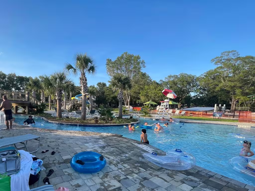 Family floating the lazy river and pools at Splash RV Resort near Navarre Beach