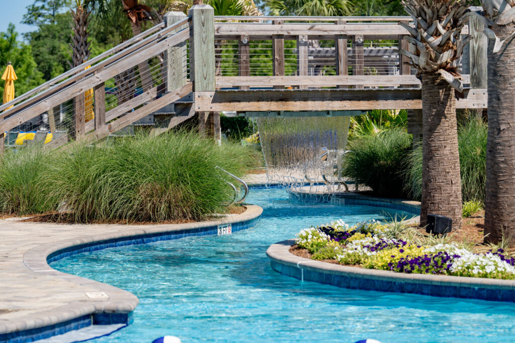 Guests floating and relaxing on the lazy river water attraction at Splash RV Resort near Pensacola Florida