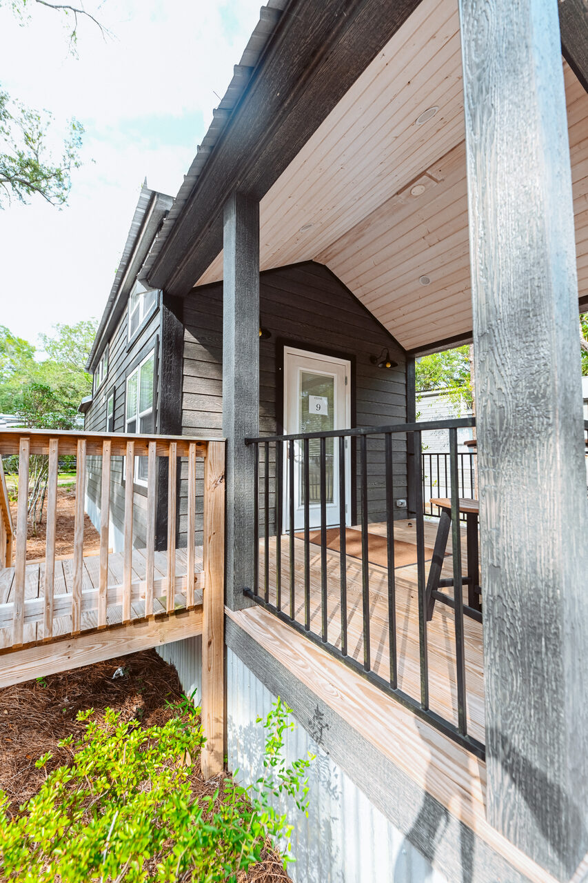 Modern luxury cottage with a covered porch at Splash RV Resort near Pensacola