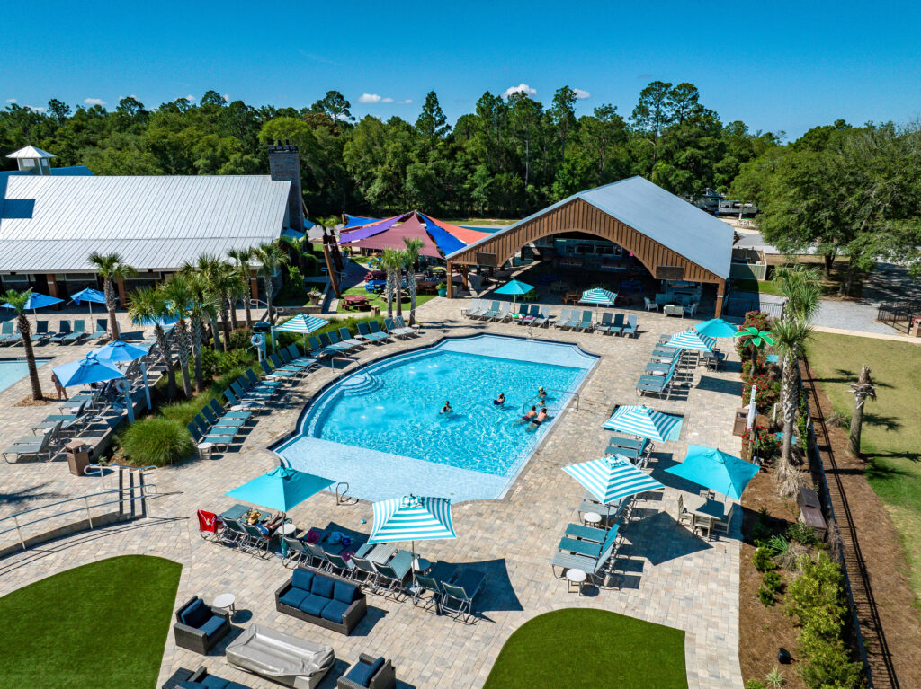 Aerial view of the pools, lazy river, and RV sites at Splash RV Resort near Pensacola and Navarre Beach Florida