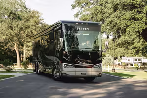 Class-A motorhome parked on a paved full-hookup site at Splash RV Resort near Pensacola