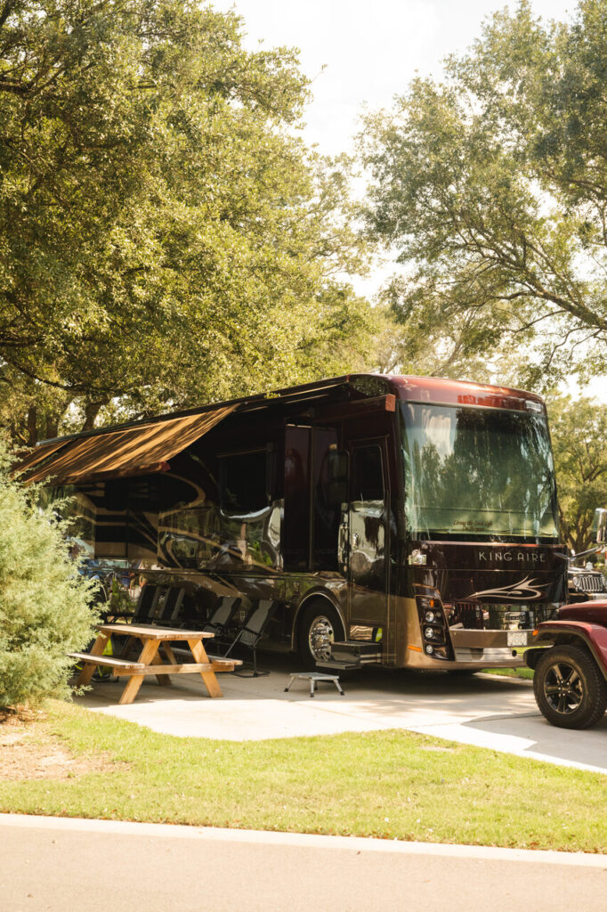 Full-hookup concrete RV site with room between neighbors at Splash RV Resort near Pensacola