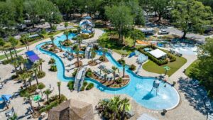 Aerial view of the lazy river, pools, and water slides at Splash RV Resort near Destin FL