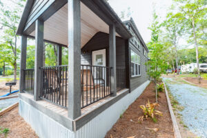 Luxury cottage with a covered porch at Splash RV Resort near Pensacola Beach Florida