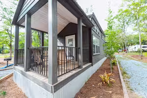 Luxury cottage with a covered porch at Splash RV Resort near Pensacola Beach Florida