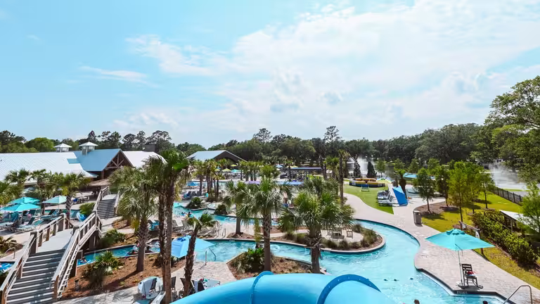 Aerial view of the lazy river, water slide, and pools at Splash RV Resort near Navarre Beach Florida