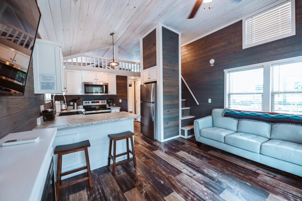 Bright modern furnished cottage interior with full kitchen at a winter RV resort in Milton FL