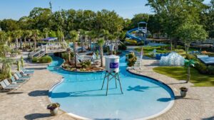 Aerial view of the heated pool, lazy river and water slide at Splash RV Resort near Pensacola