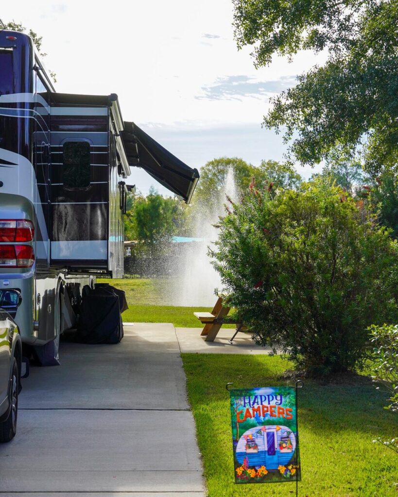 Motorhome set up on a concrete full hookup RV site near Pensacola at Splash RV Resort