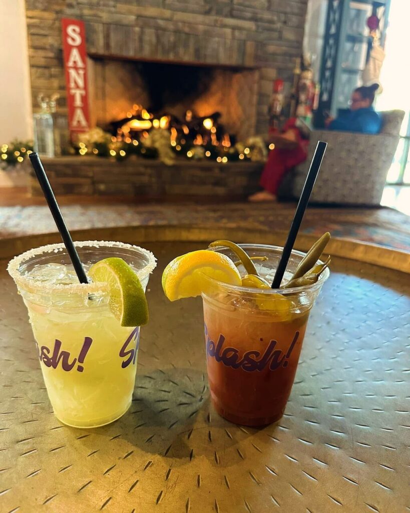 Warm drinks by the lit stone fireplace in the lodge at Splash RV Resort near Pensacola FL in December