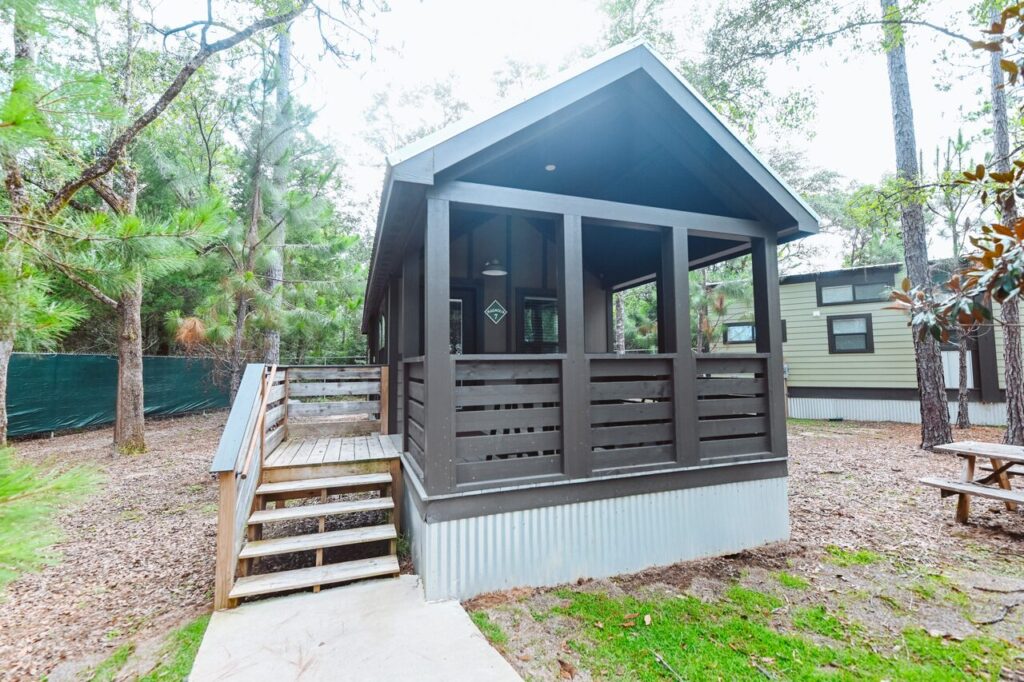 Dark gray luxury cottage with a front porch, an alternative to Perdido Key vacation home rentals