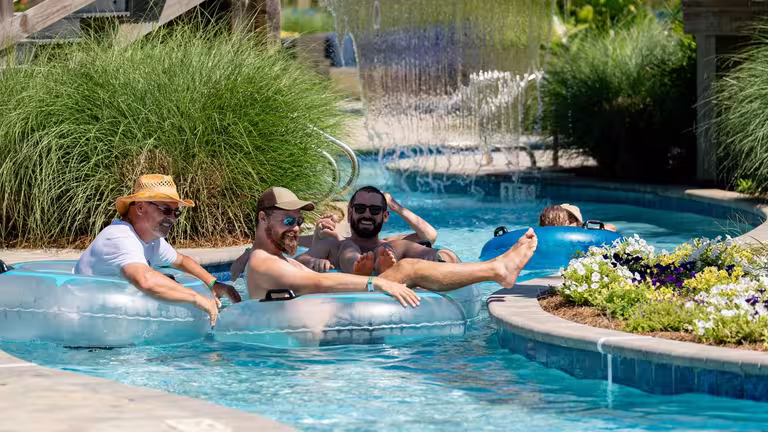 Guests floating the year-round lazy river at Splash RV Resort near Pensacola.