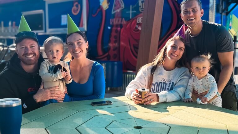 Two families with young children gathered outdoors at Splash RV Resort near Perdido Key, Florida