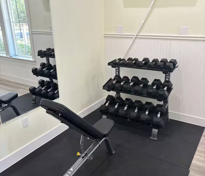 Adjustable weight bench and dumbbell rack in the Splash RV Resort fitness center.