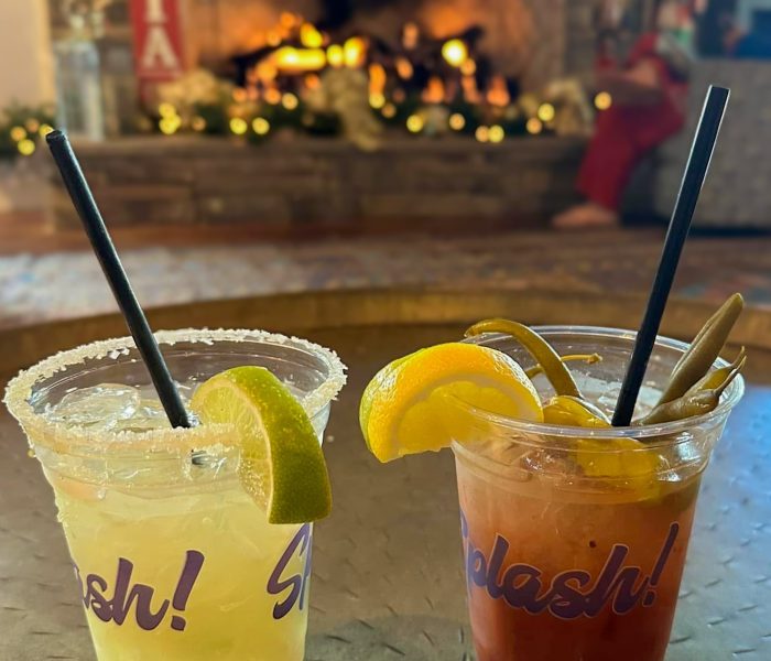 Holiday cocktails at Splash RV Resort with a cozy fireplace in the background
