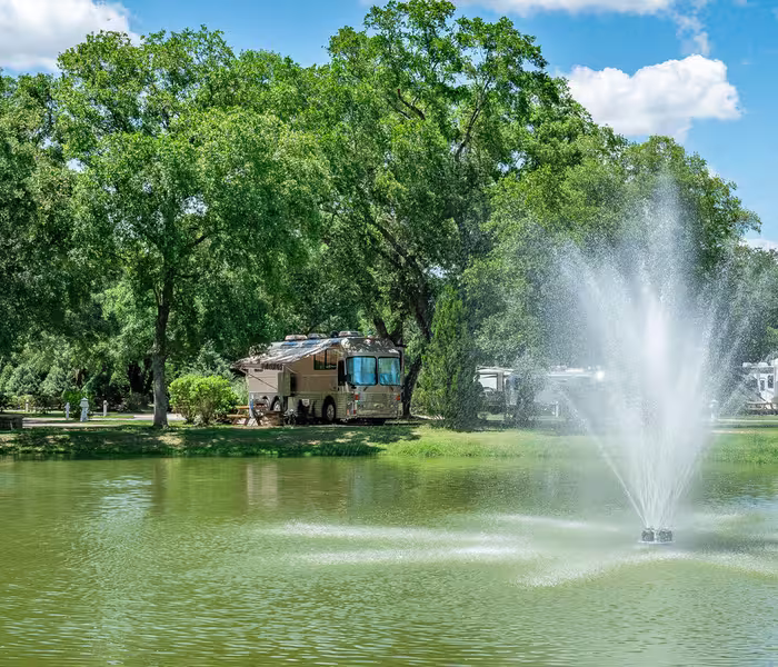 Splash RV Resort lakeside fountain with motorhome